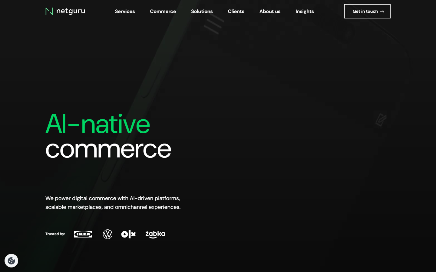 Netguru homepage with an AI-native commerce headline on a dark background and IKEA, Volkswagen, OLX, and Żabka logos.